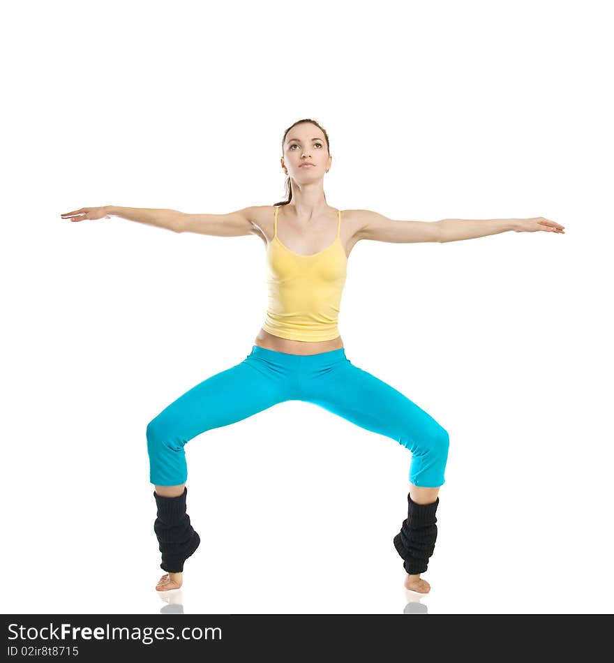 Beautiful girl doing gymnastics on white background