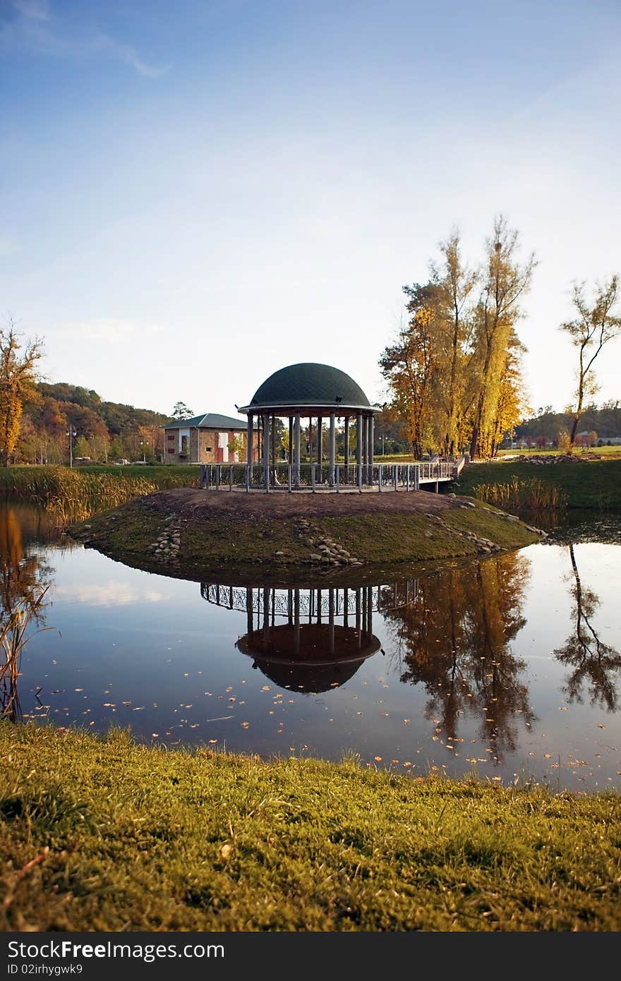 The autumn landscape is in the reflection of water