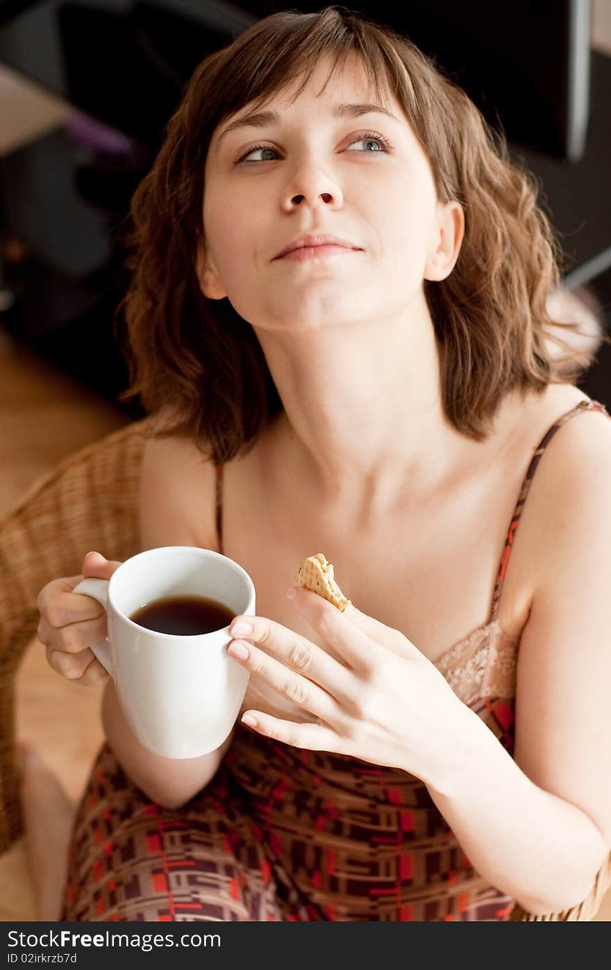 Girl with snack and cup of tea (coffee). Girl with snack and cup of tea (coffee)