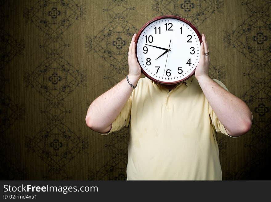 An image of a man with a big white clock