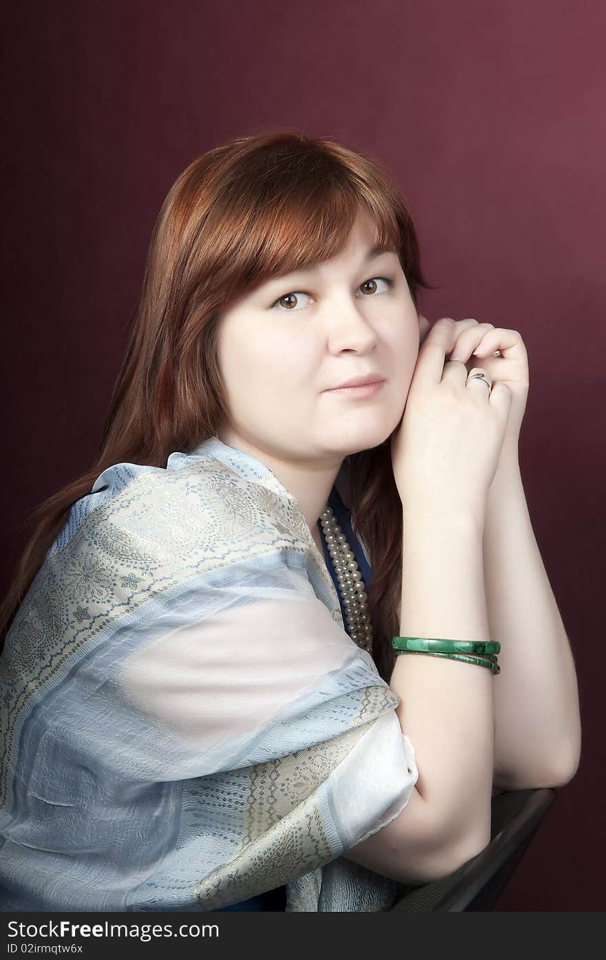 Brunette with smile an sad eyes, studio shot