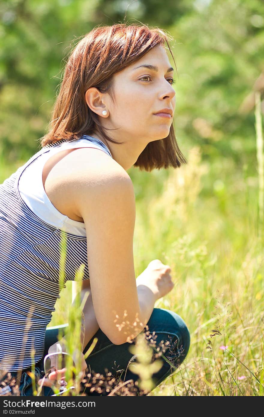 Pretty smiling girl relaxing outdoor. Pretty smiling girl relaxing outdoor