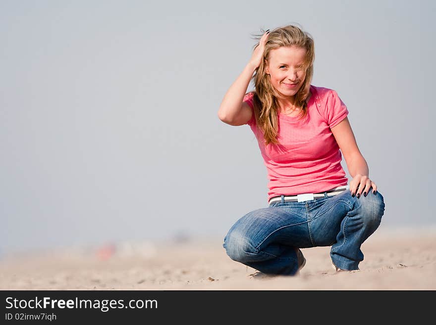 Young woman on sea shore