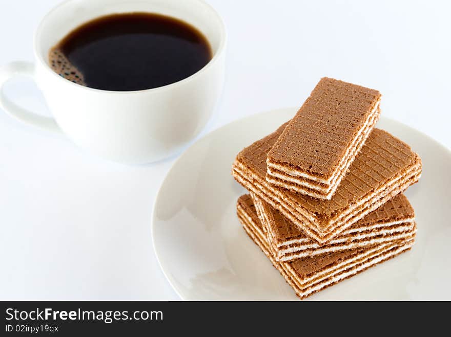 Coffee and wafers on the plate