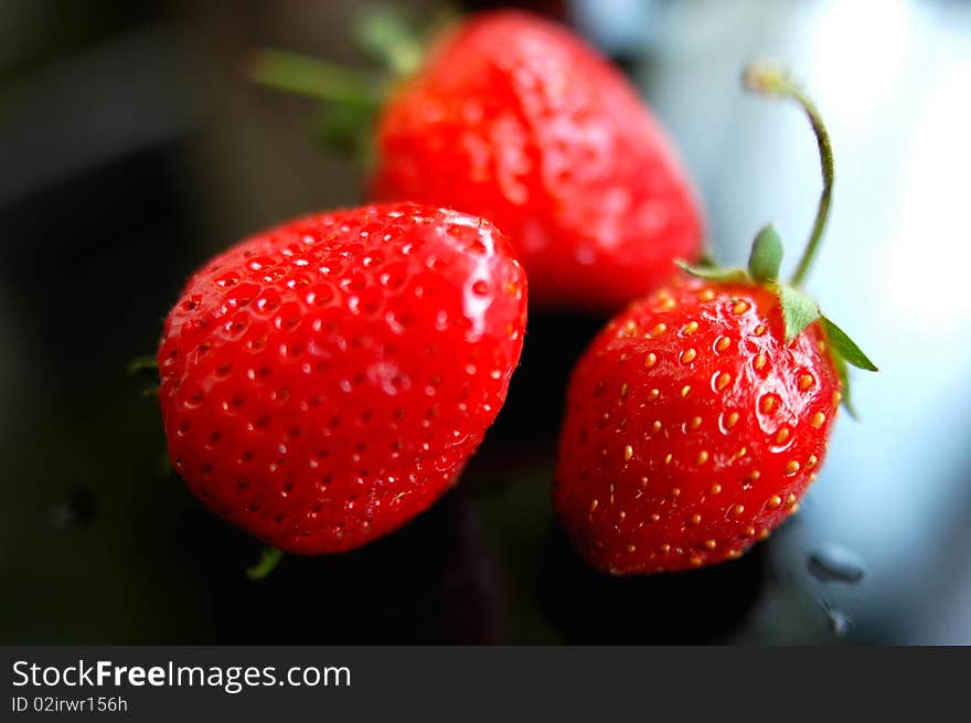 Fresh red strawberry isolated on a blurred background