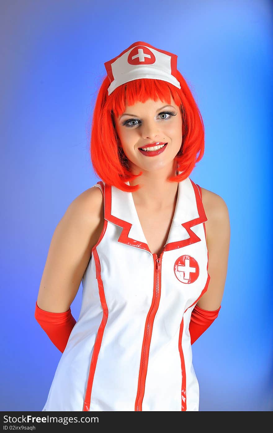 Young beautiful nurse in uniform and red hair. Young beautiful nurse in uniform and red hair