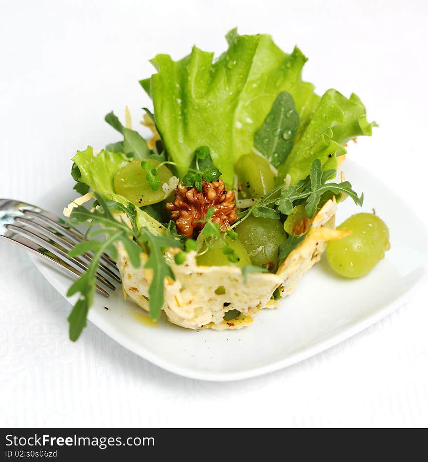 Parmesan, walnut and arugula baskets