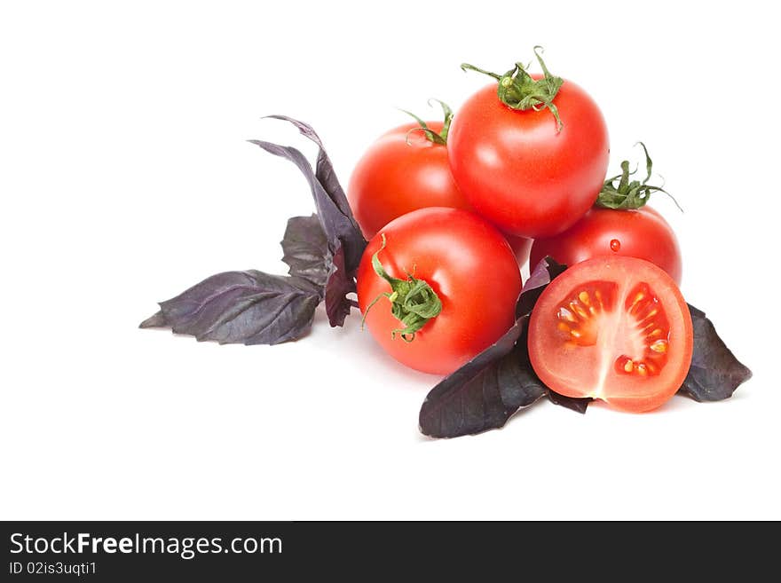 Tomato with basil on a white background