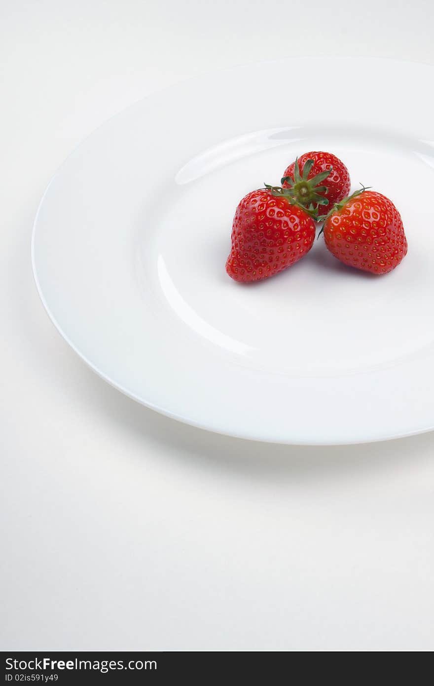 Three strawberry on a plate