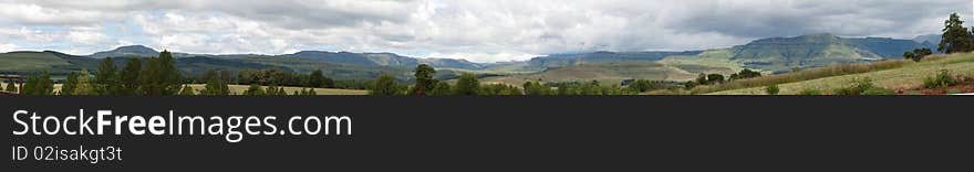 A panoramic view of the Drakensberg from the Clarens area on a cloudy day