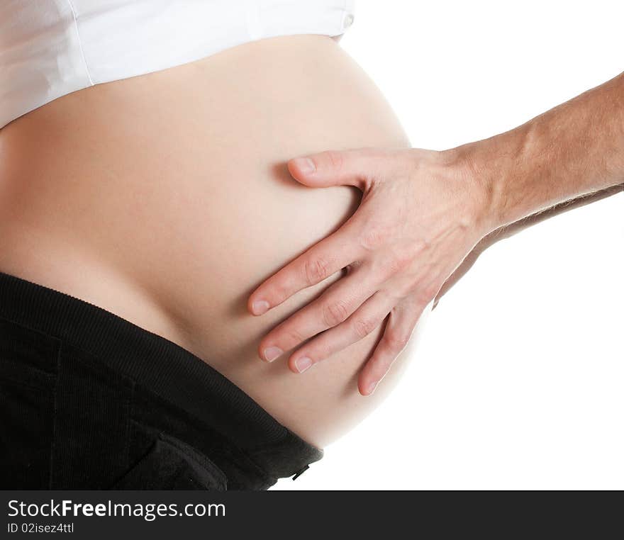 Advanced pregnant belly with hands