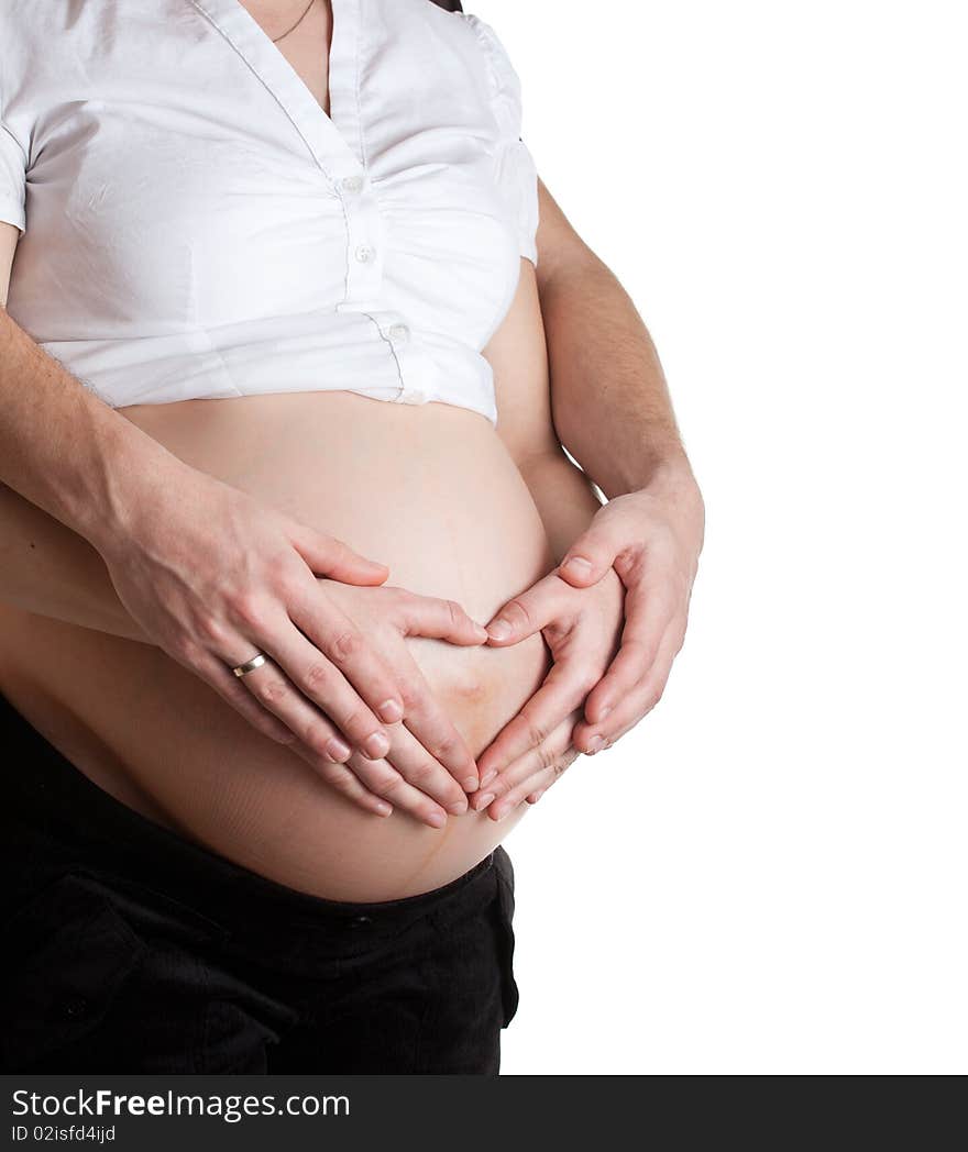 Advanced pregnant belly with woman and man hands. Advanced pregnant belly with woman and man hands