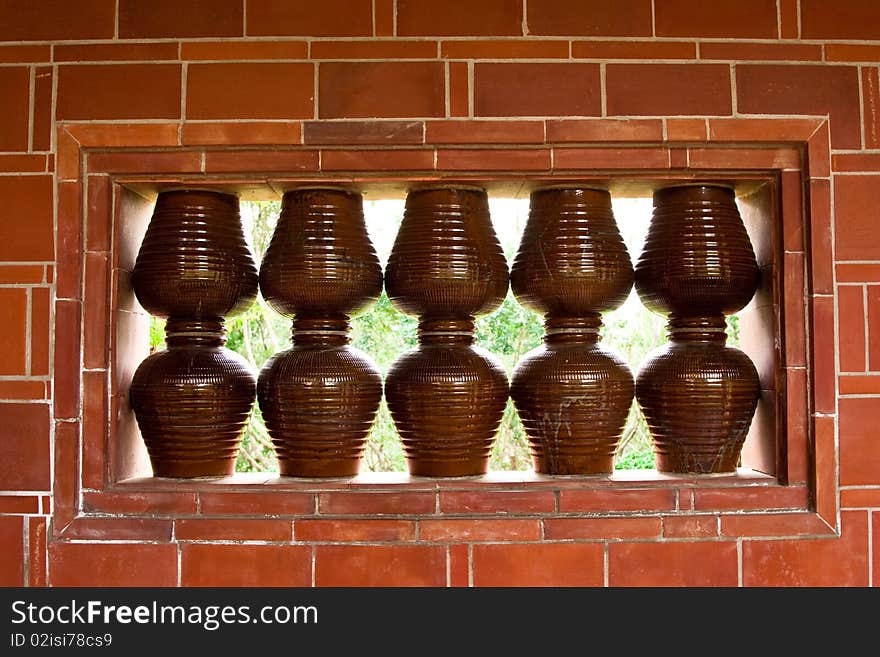 Earthenware pots and red brick wall. Earthenware pots and red brick wall