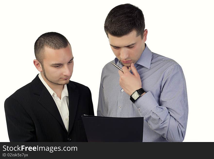 Two business people looking in documents. Two business people looking in documents