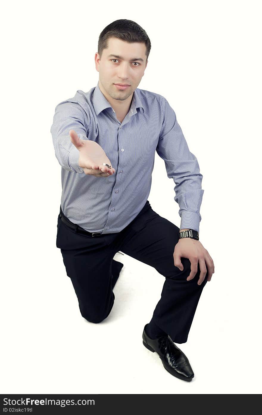 Man offering ring isolated on white. Man offering ring isolated on white