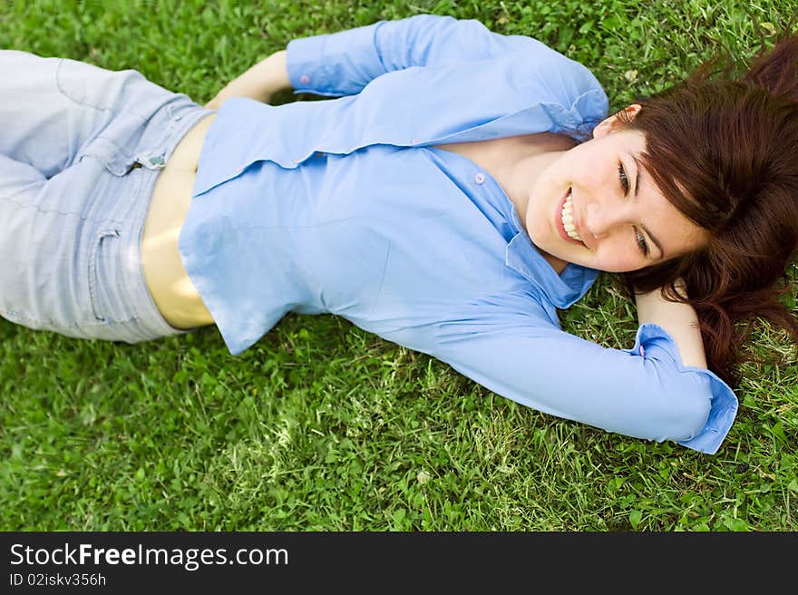 Pretty Girl Lying On Grass