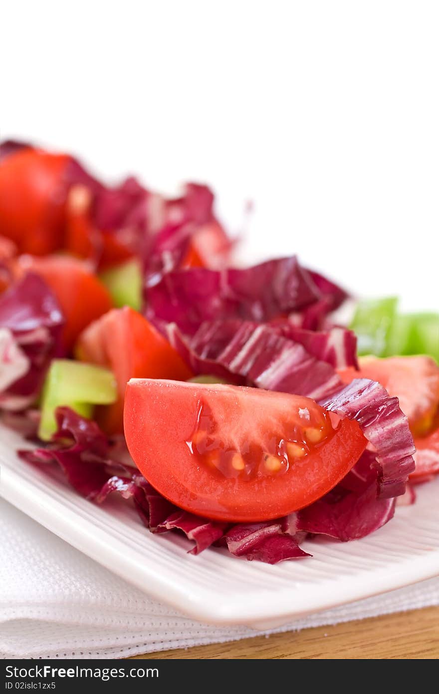 Closeup Of Radicchio Salad and Cut Tomato. Closeup Of Radicchio Salad and Cut Tomato