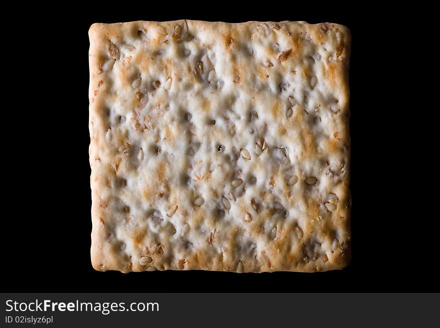 Sesame cracker isolated on black background with clipping path. Sesame cracker isolated on black background with clipping path.