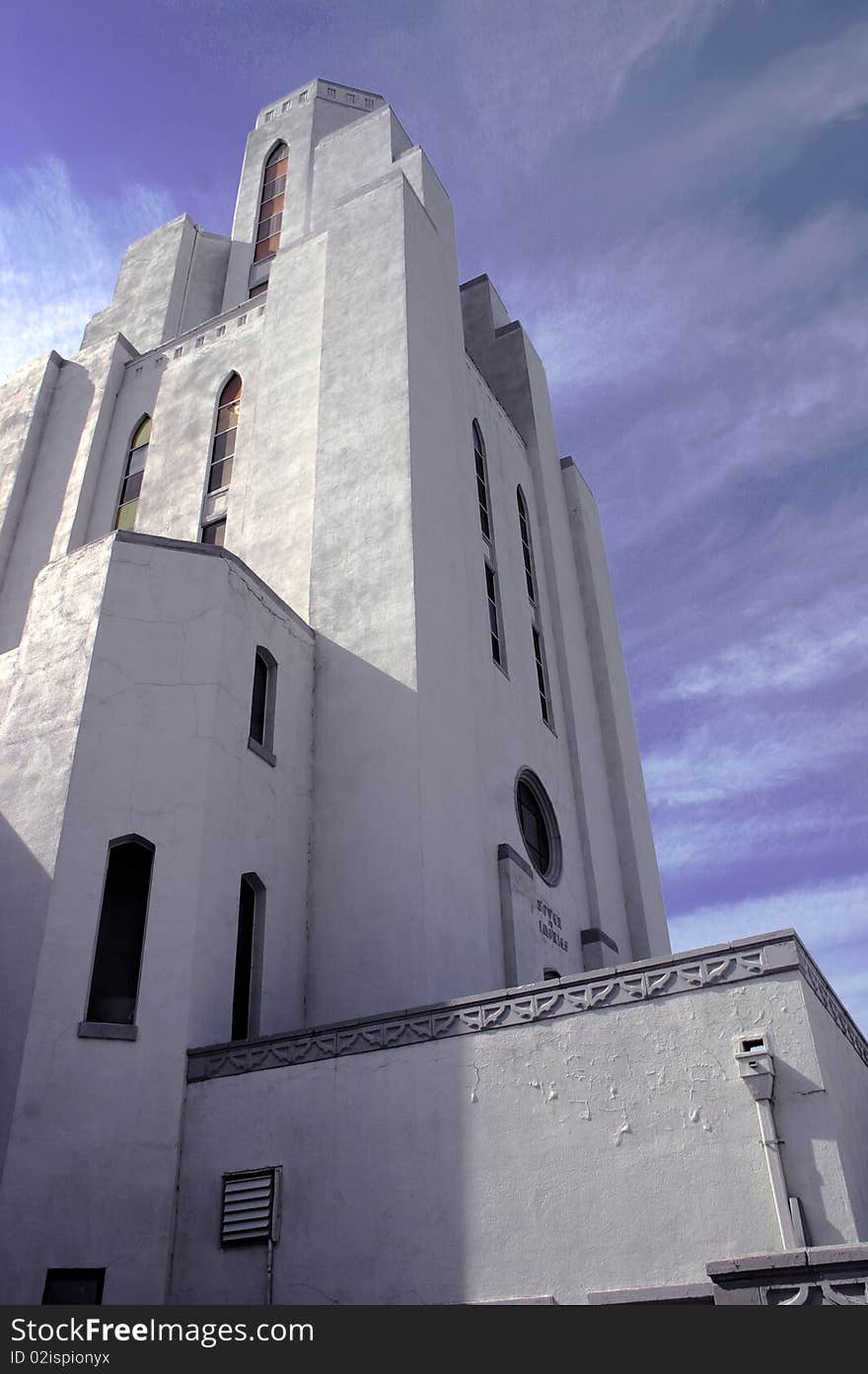 A color image of a white stone tower standing against a cloudy background. A color image of a white stone tower standing against a cloudy background.