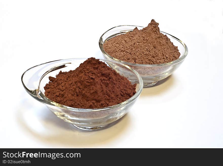 Cocoa cake and cocoa powder on a white background