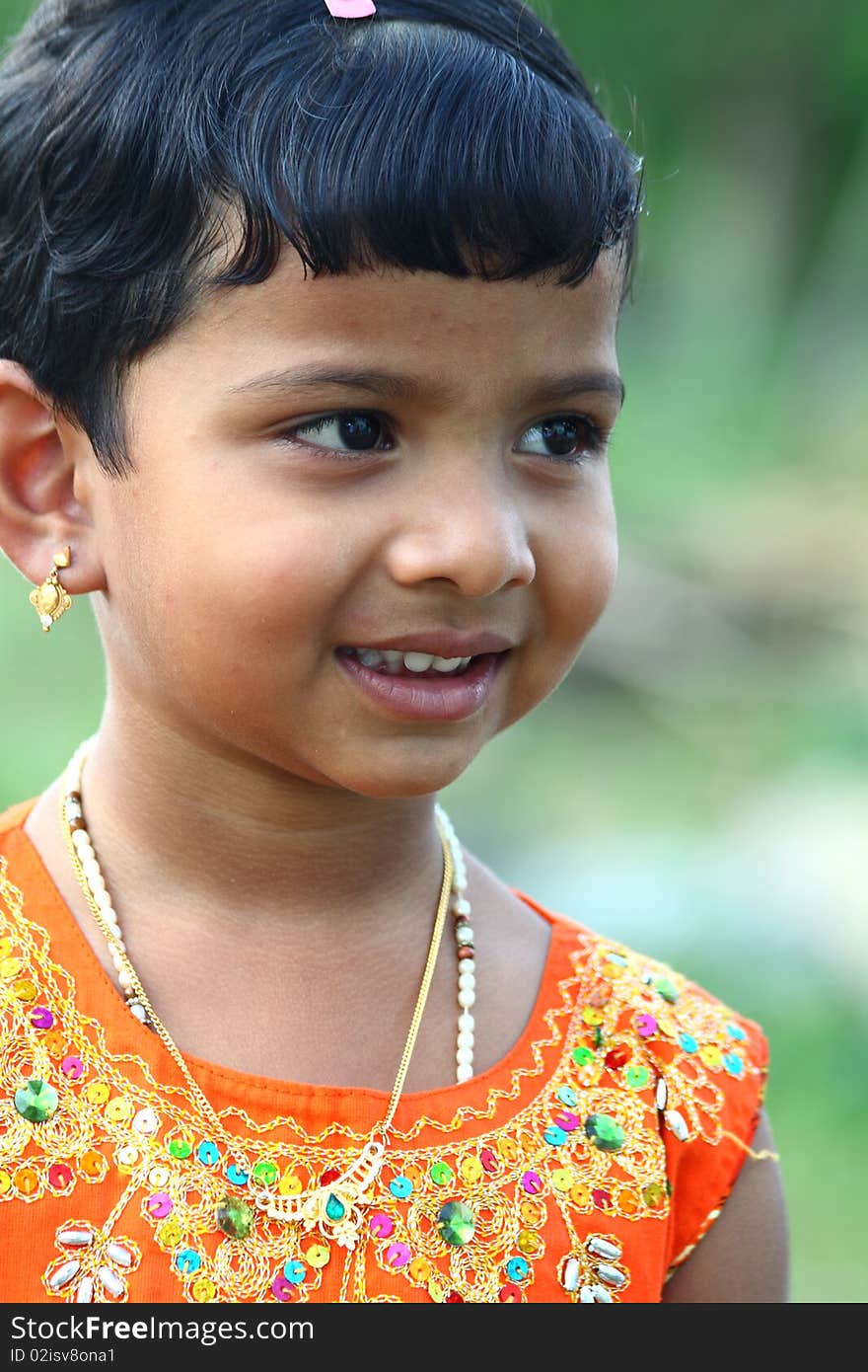 Cute Little Girl Looking Somewhere with smile