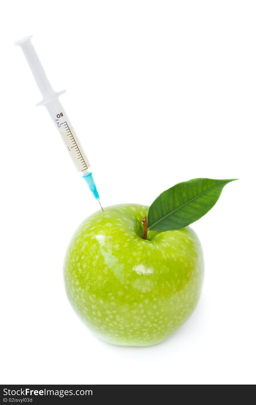 Green apple and syringe on a white background