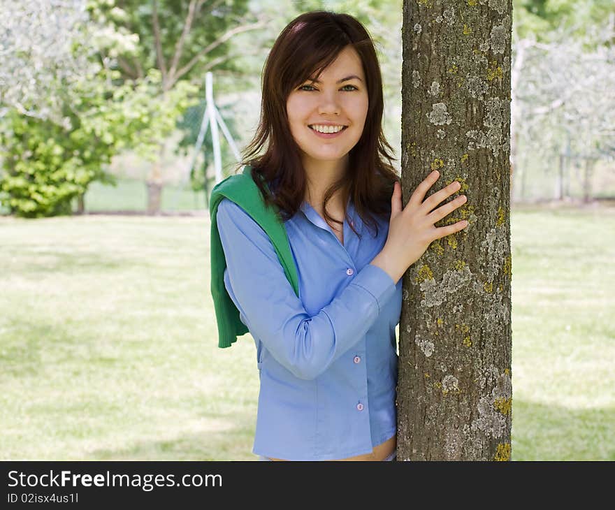 Portrait Of A Pretty Girl With A Tree