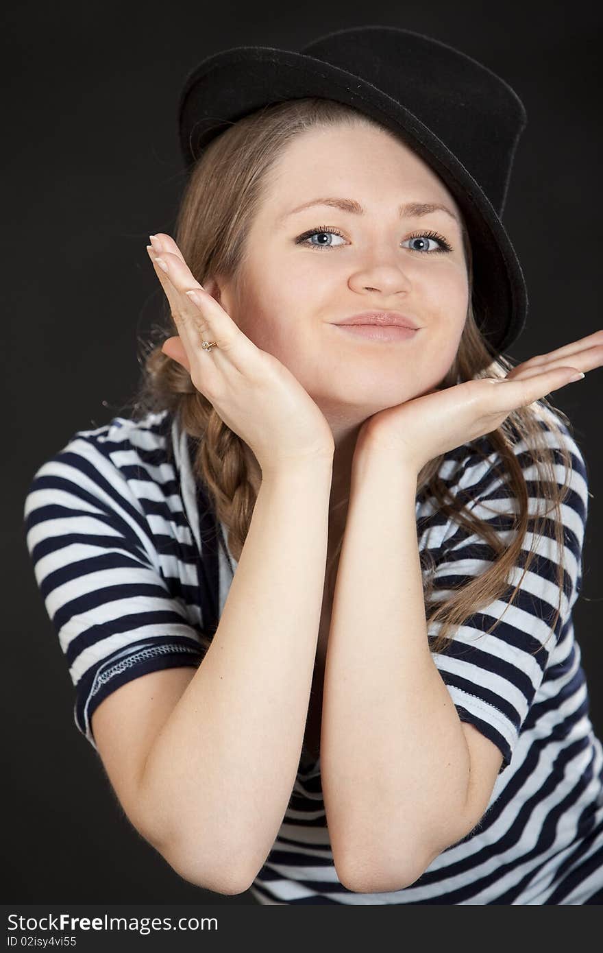 Young woman standing with fingers