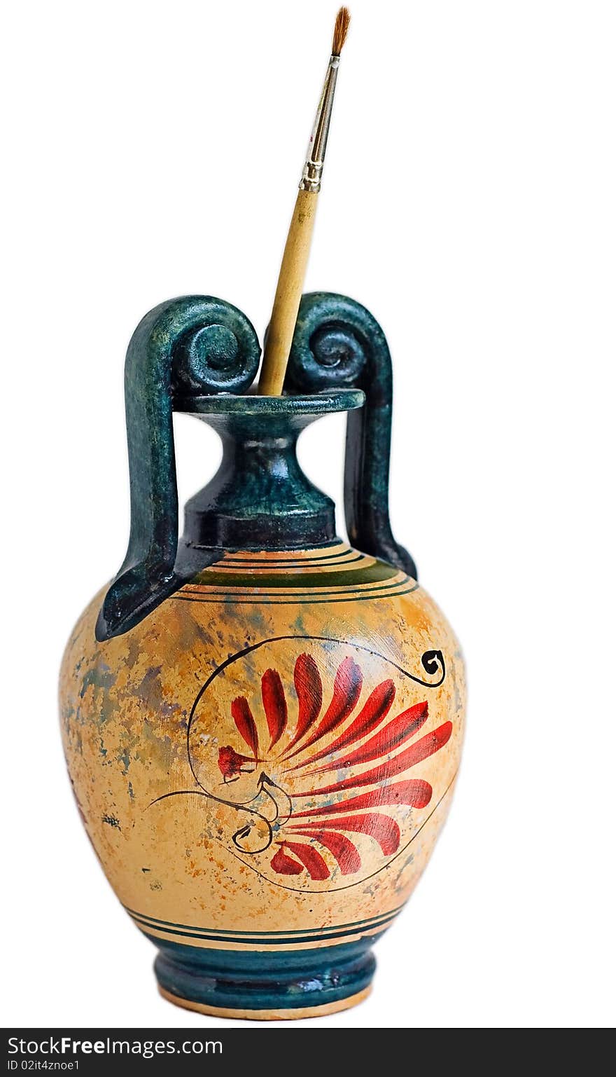 Replica of traditional greek vase with colorful red drawings and brush standing in it. Replica of traditional greek vase with colorful red drawings and brush standing in it