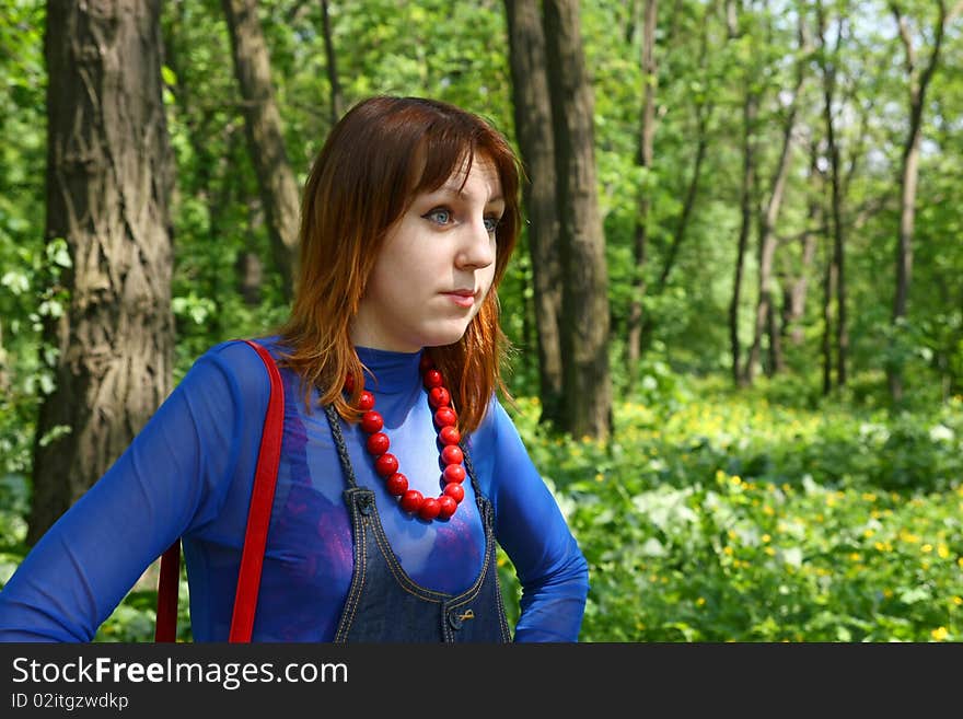 Wondered girl standind in the park, daylight