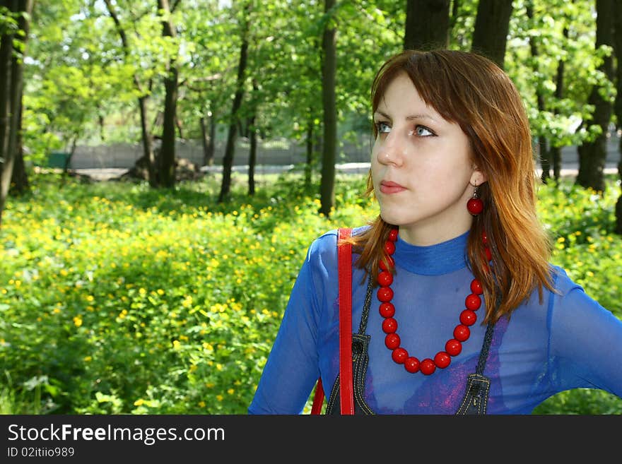 Young woman portrait on the green background