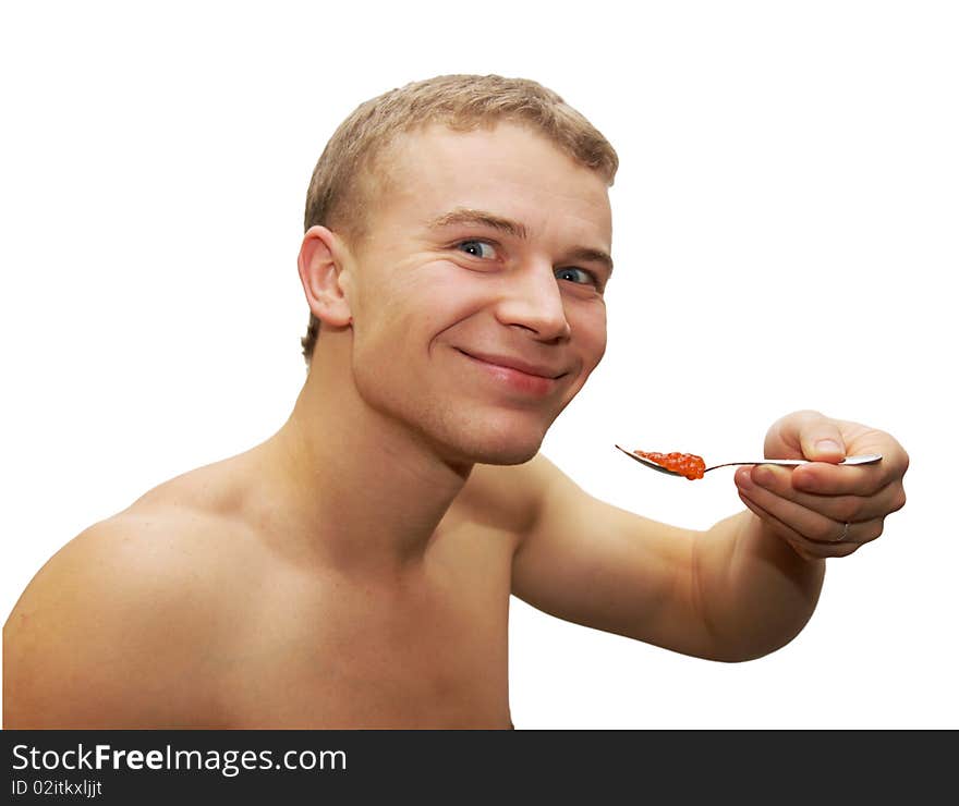 Young man eating red caviar isolated