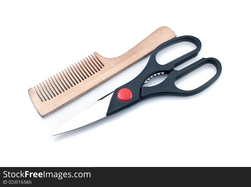 Scissors and combs isolated on a white background