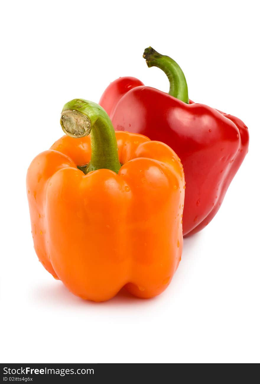 Orange and red pepper isolated on white background