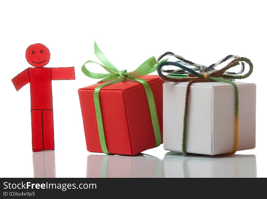 Red toy man and present boxes on white isolated bacground