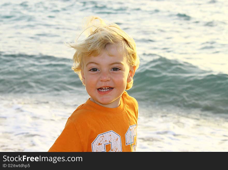 Cute blond boy on a day at the beach. Cute blond boy on a day at the beach.