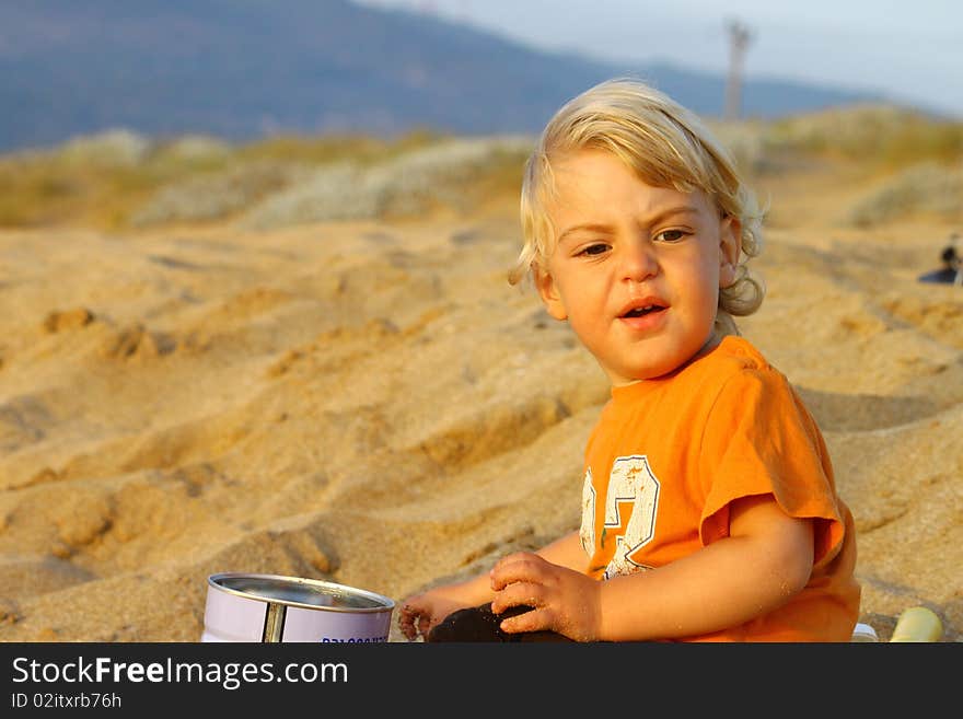 Cute blond boy on a day at the beach. Cute blond boy on a day at the beach.