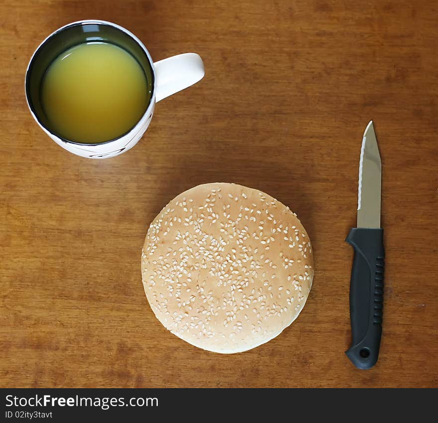 Eat quickly: hamburger with orange juice on the table. Eat quickly: hamburger with orange juice on the table.