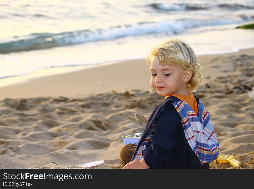 Cute blond boy on a day at the beach. Cute blond boy on a day at the beach.