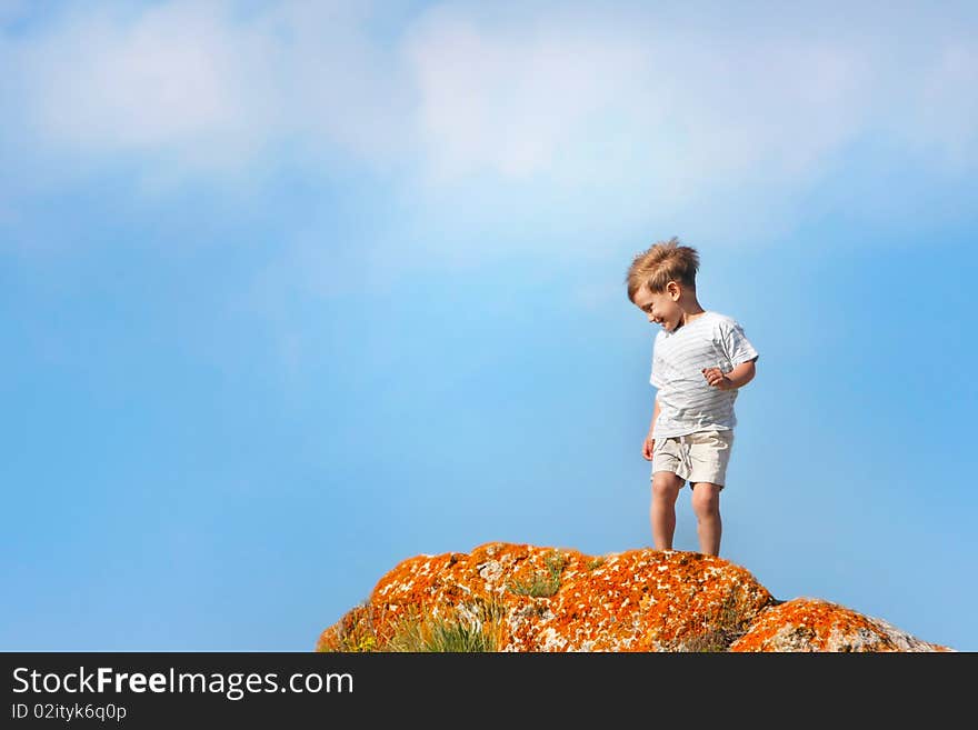 Happy boy outdoors on sky background