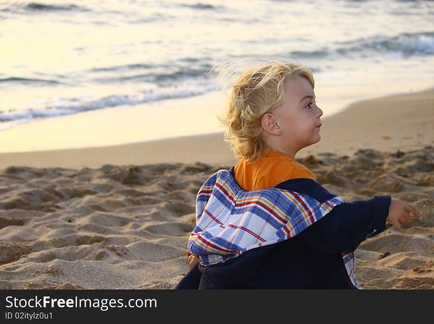 Cute blond boy on a day at the beach. Cute blond boy on a day at the beach.