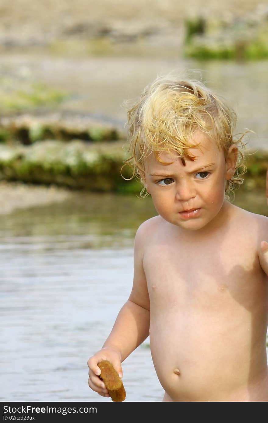 Cute blond boy on a day at the beach. Cute blond boy on a day at the beach.