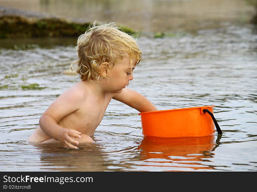 Cute blond boy on a day at the beach. Cute blond boy on a day at the beach.