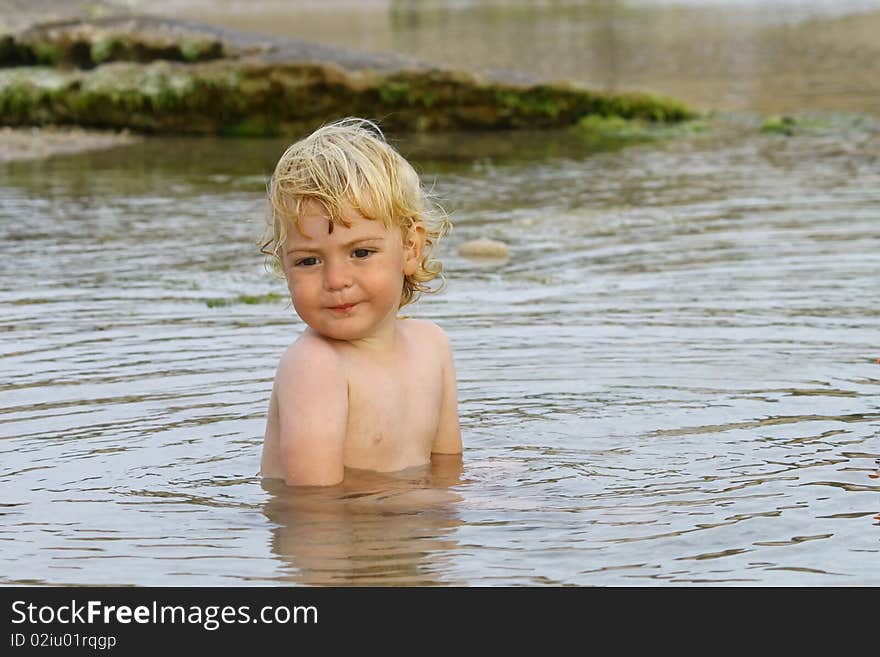 Cute blond boy on a day at the beach. Cute blond boy on a day at the beach.