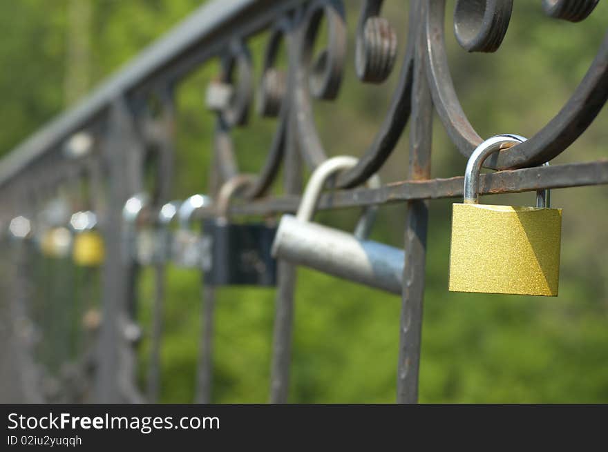 Locks of love on bridge. Symbol of everlasting love