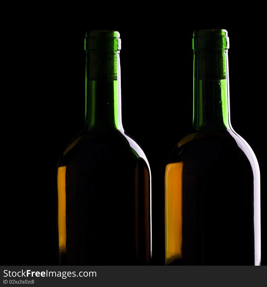 Old wine. Still life over black background