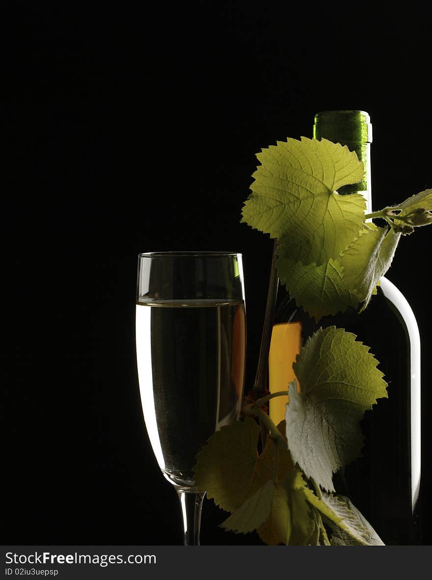 Old wine. Still life over black background