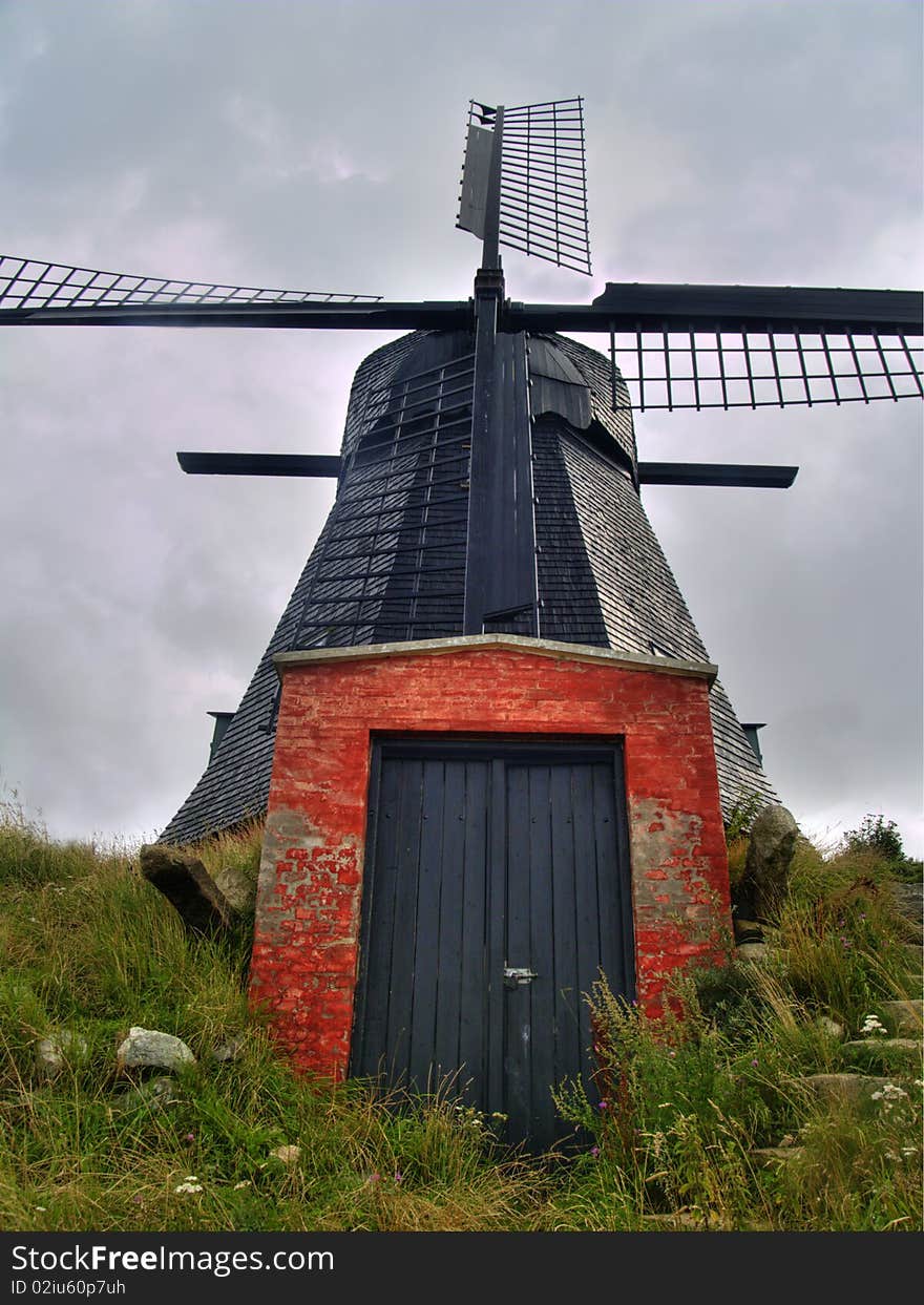 Old and red windmill located in the North of Denmark. Old and red windmill located in the North of Denmark