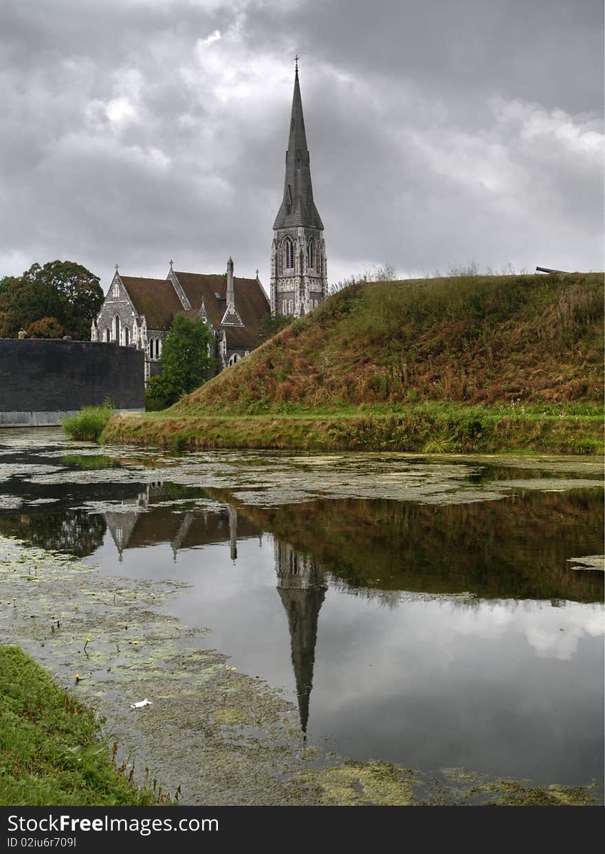 Church reflecting in the water in a park in Copenhagen, Denmark. Church reflecting in the water in a park in Copenhagen, Denmark