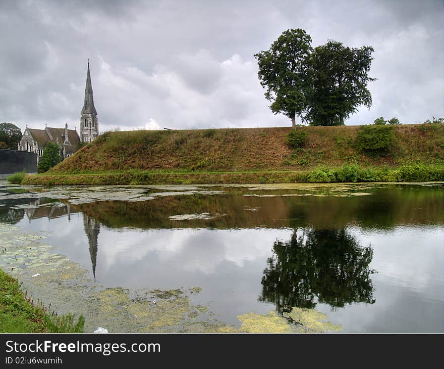 Church reflecting in the water in a park in Copenhagen, Denmark. Church reflecting in the water in a park in Copenhagen, Denmark